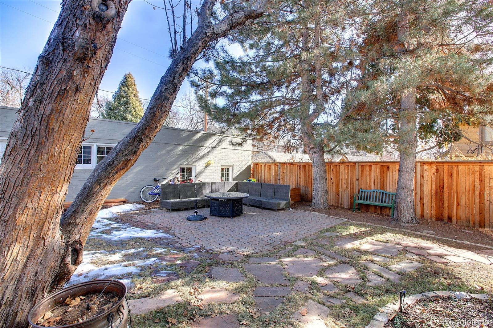 570 Gilpin Street Denver, CO 80218 - Photo 30 of 30 a view of a backyard with a tree