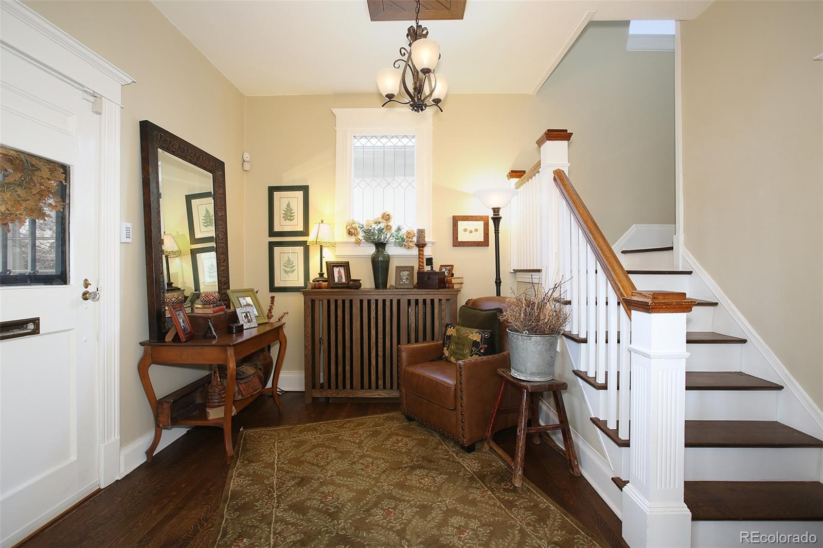 570 Gilpin Street Denver, CO 80218 - Photo 3 of 30 a living room with furniture and a chandelier