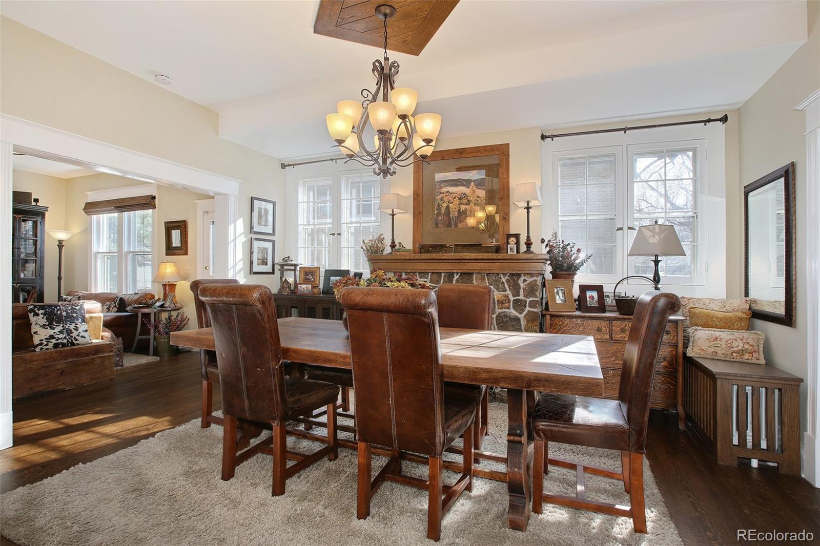 570 Gilpin Street Denver, CO 80218 - Photo 5 of 30 a view of a dining room with furniture and a chandelier