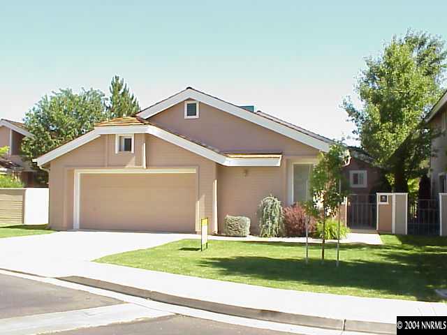 3283 Spring Creek Circle Reno, NV 89509 - Photo 1 of 1 a front view of a house with a yard and garage