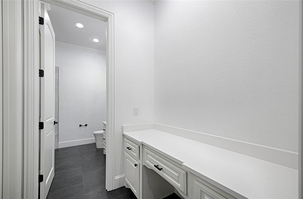 6301 Churchill Way Dallas, TX 75230 - Photo 36 of 40 Bathroom with toilet, baseboards, recessed lighting, tile patterned flooring, and crown molding