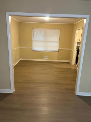 a view of an empty room and window