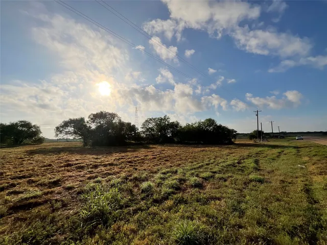 a view of outdoor space with deck and yard