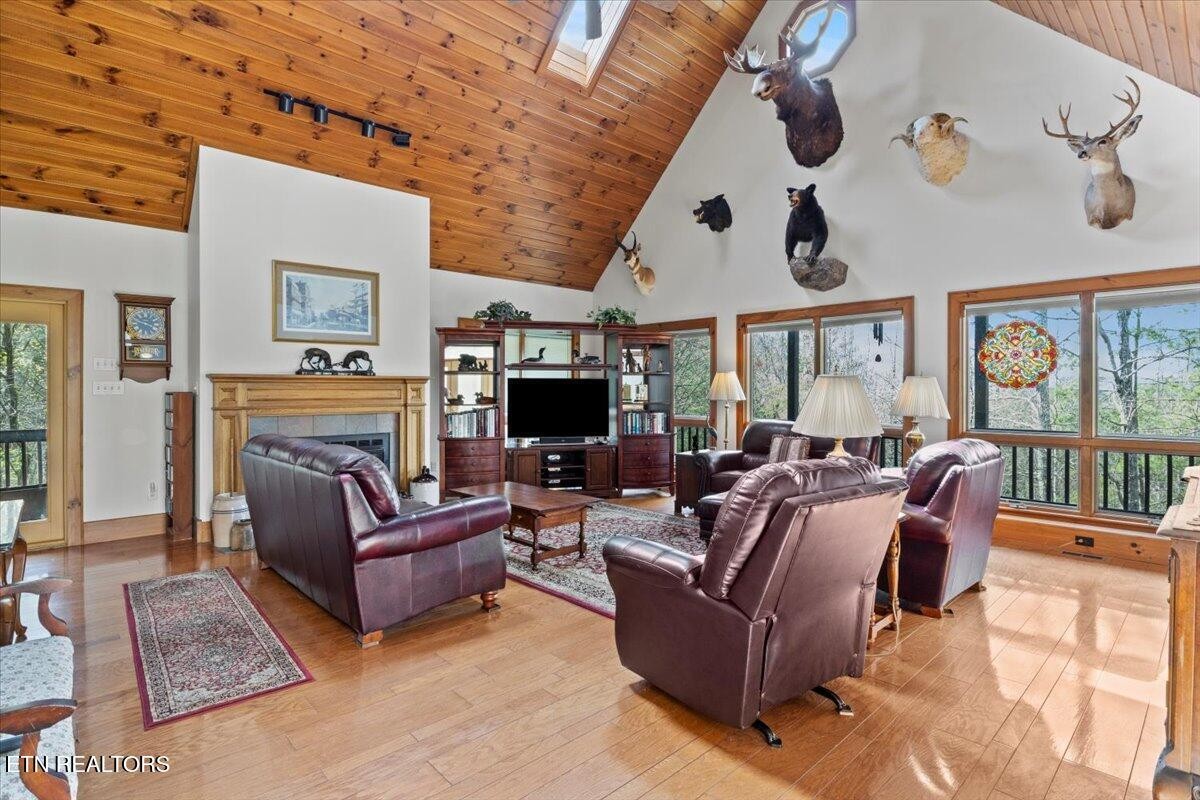 802 Stonegate Way Townsend, TN 37882 - Photo 11 of 44 a living room with furniture large window and a fireplace