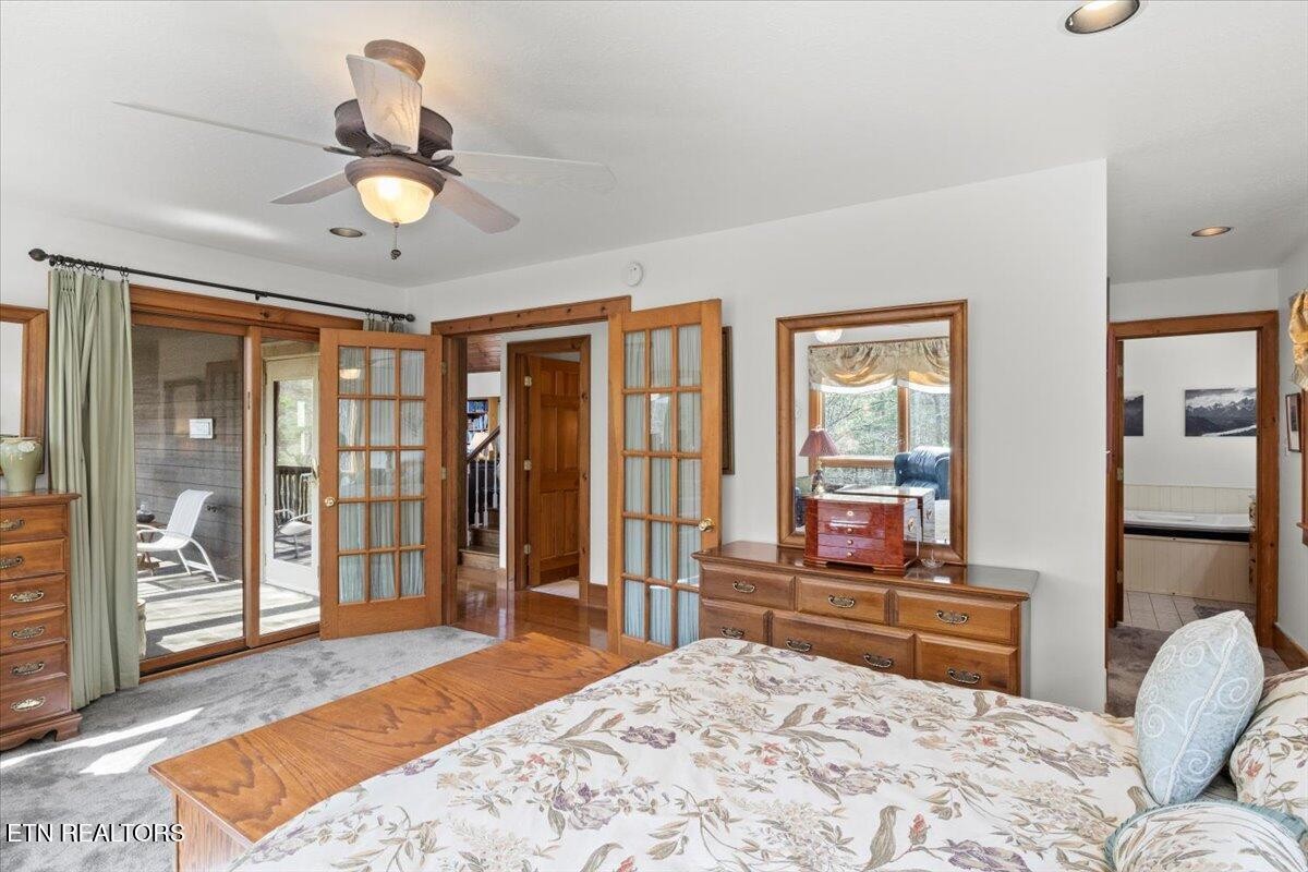 802 Stonegate Way Townsend, TN 37882 - Photo 19 of 44 a bedroom with a bed and wooden floor
