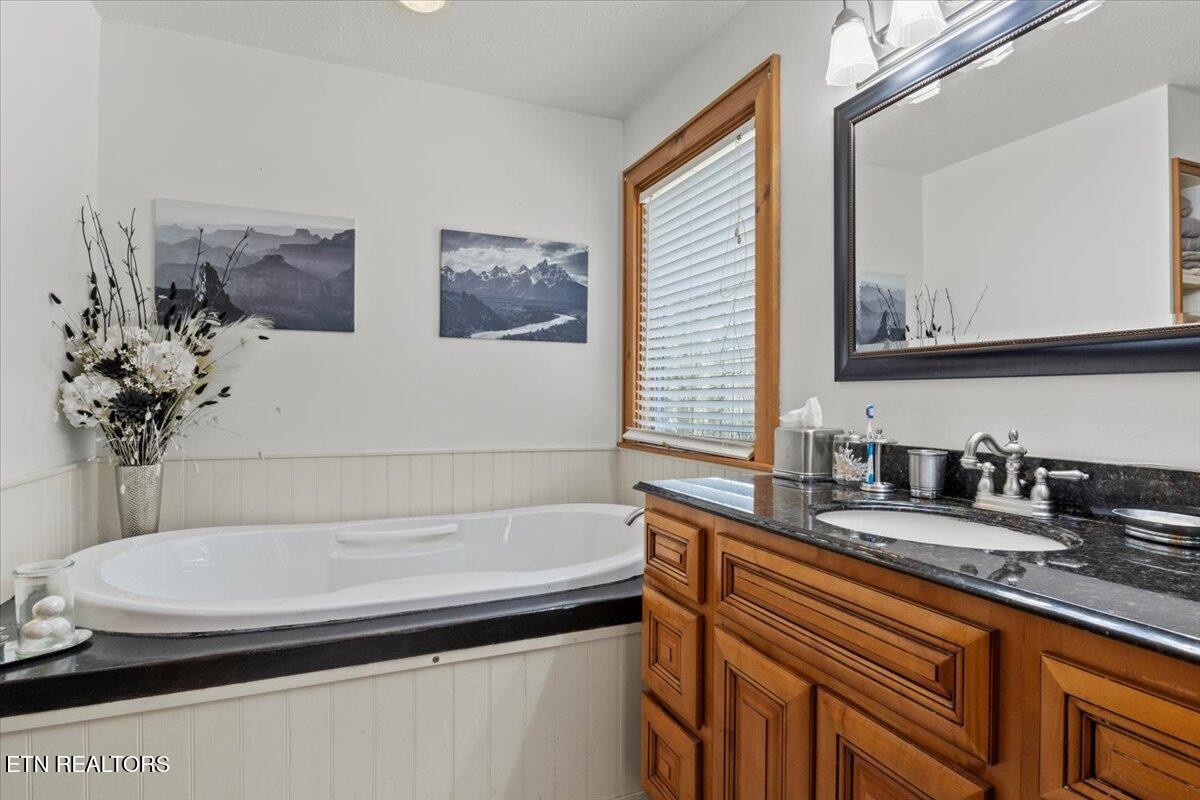 802 Stonegate Way Townsend, TN 37882 - Photo 20 of 44 a bathroom with a sink and a mirror