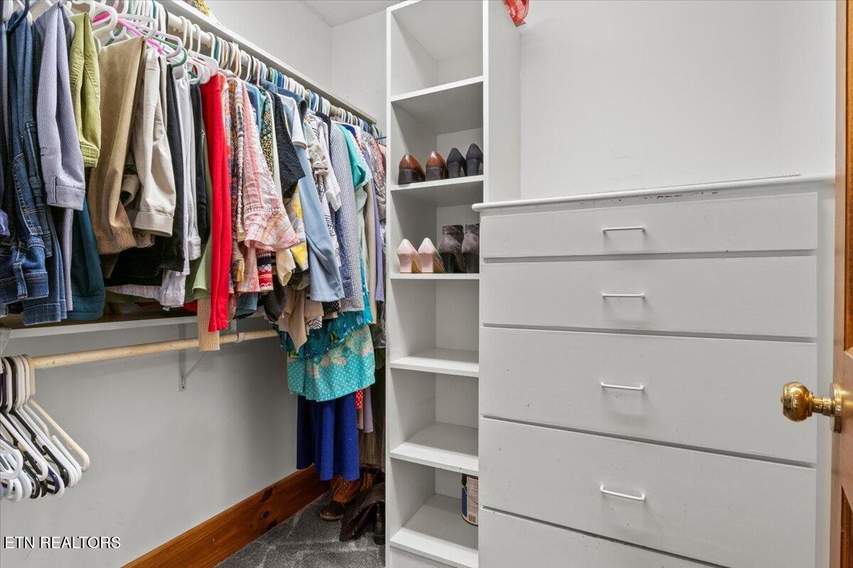 802 Stonegate Way Townsend, TN 37882 - Photo 23 of 44 a view of walk in closet with clothes and shoes