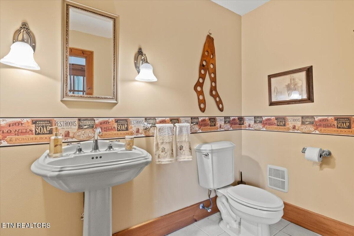 802 Stonegate Way Townsend, TN 37882 - Photo 24 of 44 a bathroom with a sink and a mirror