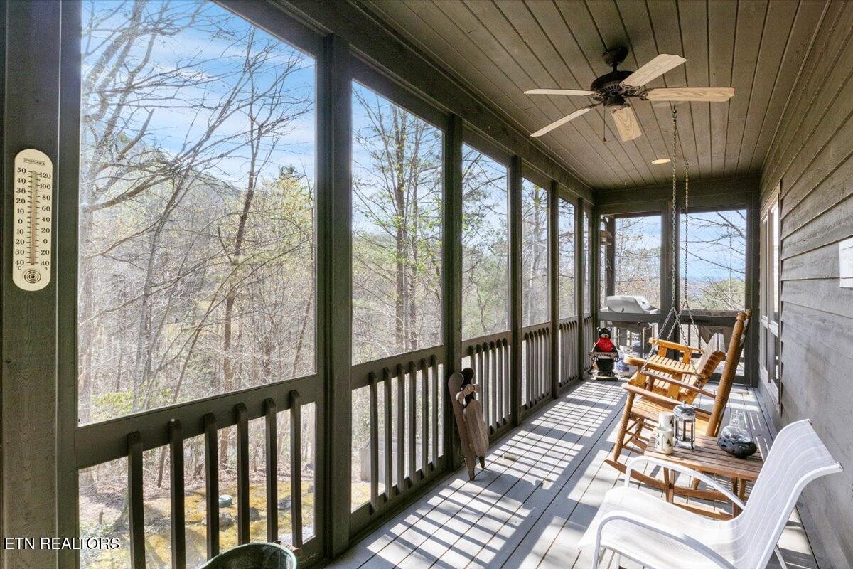 802 Stonegate Way Townsend, TN 37882 - Photo 32 of 44 a balcony with furniture and wooden floor