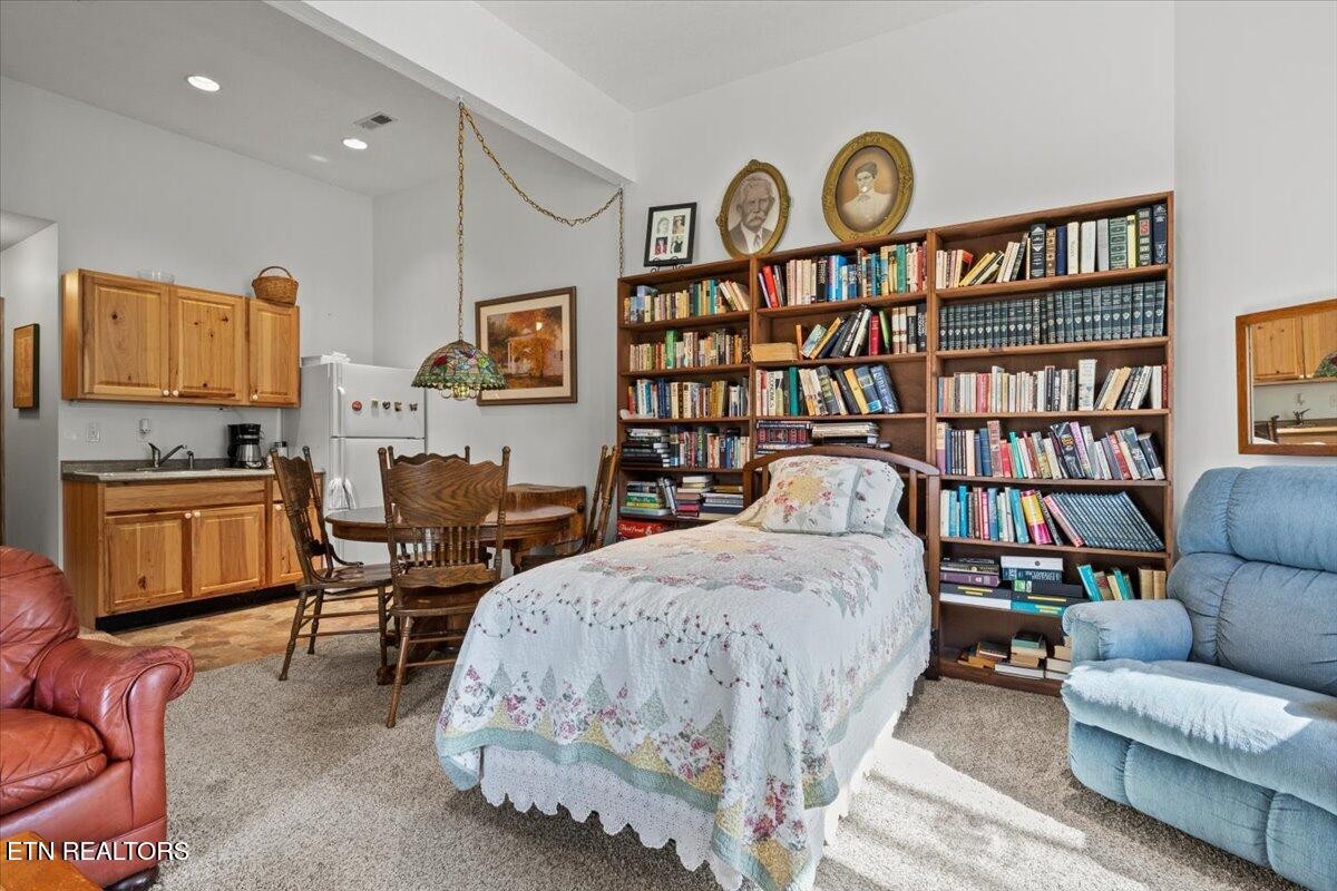 802 Stonegate Way Townsend, TN 37882 - Photo 35 of 44 a bedroom with bed and a book shelf