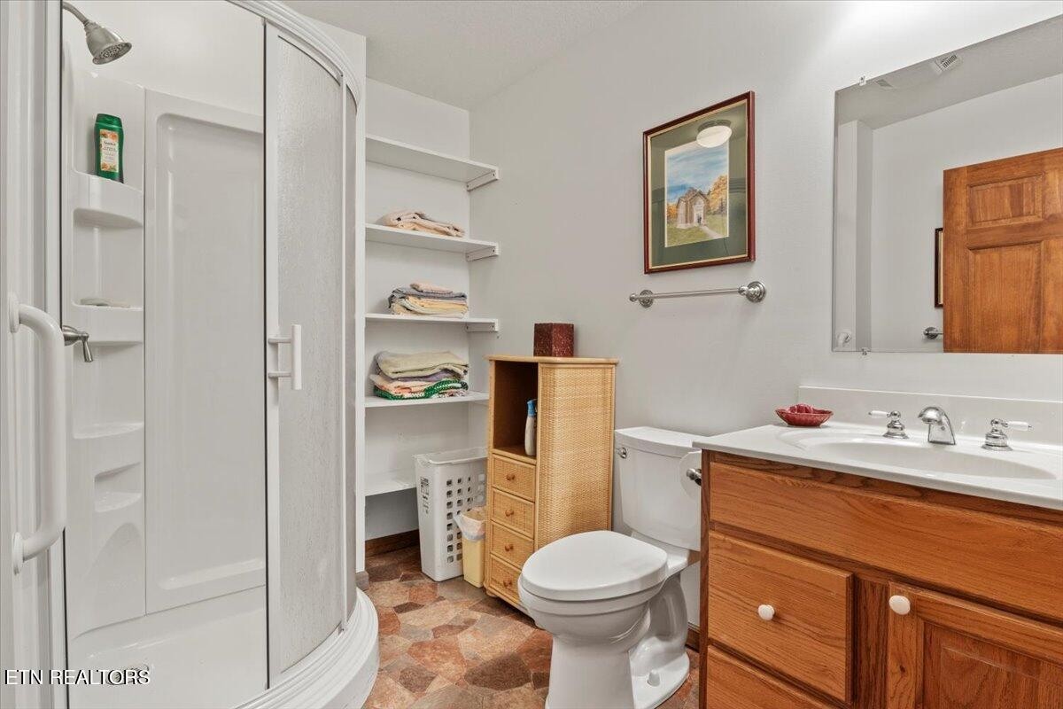 802 Stonegate Way Townsend, TN 37882 - Photo 38 of 44 a bathroom with a sink a toilet and shower