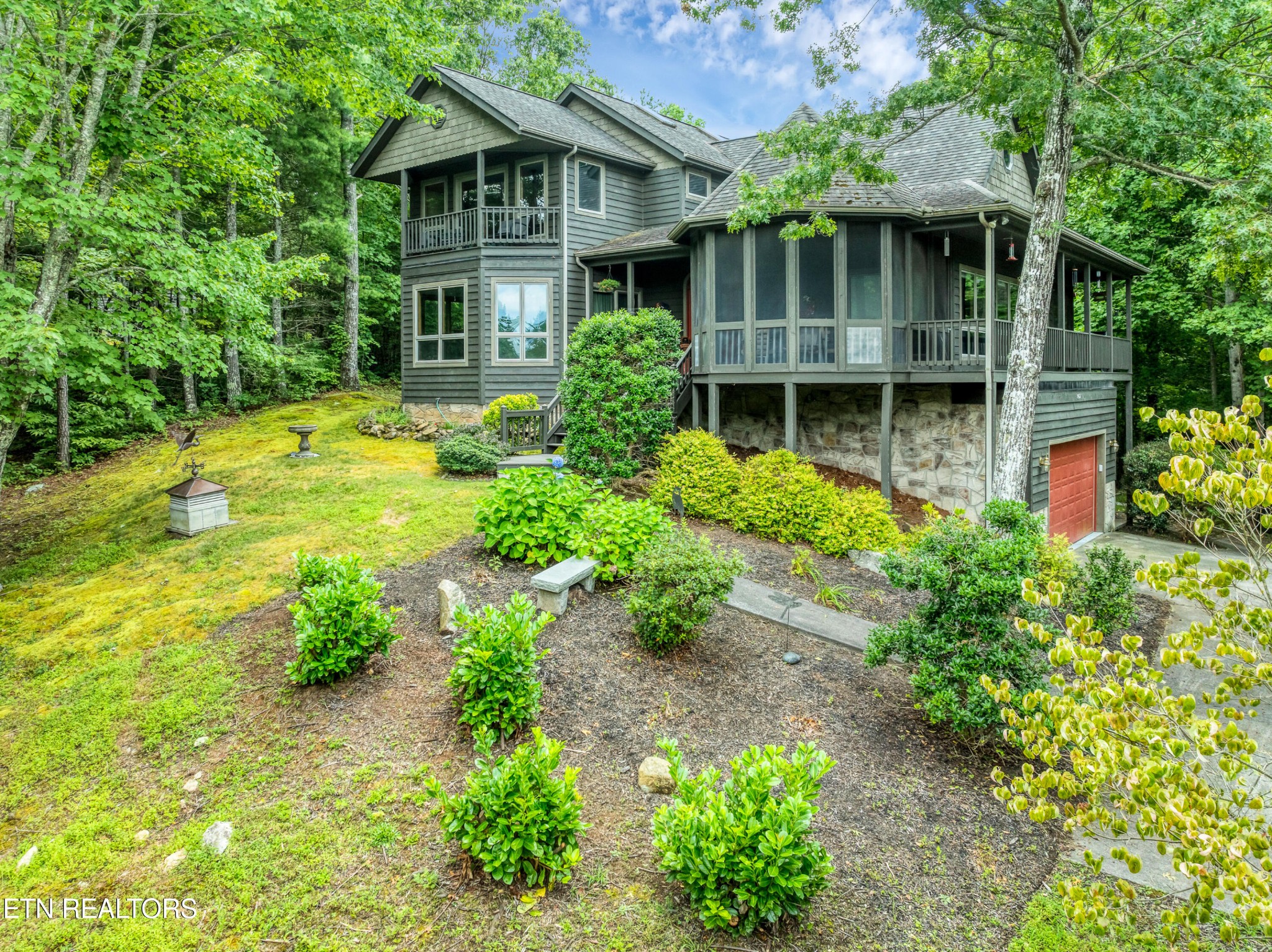 802 Stonegate Way Townsend, TN 37882 - Photo 6 of 44 a front view of a house with garden