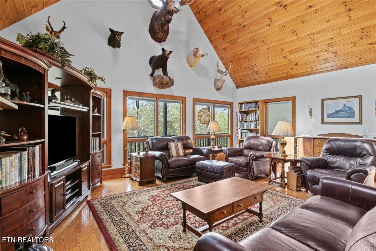 802 Stonegate Way Townsend, TN 37882 - Photo 10 of 44 a living room with furniture a rug and a flat screen tv