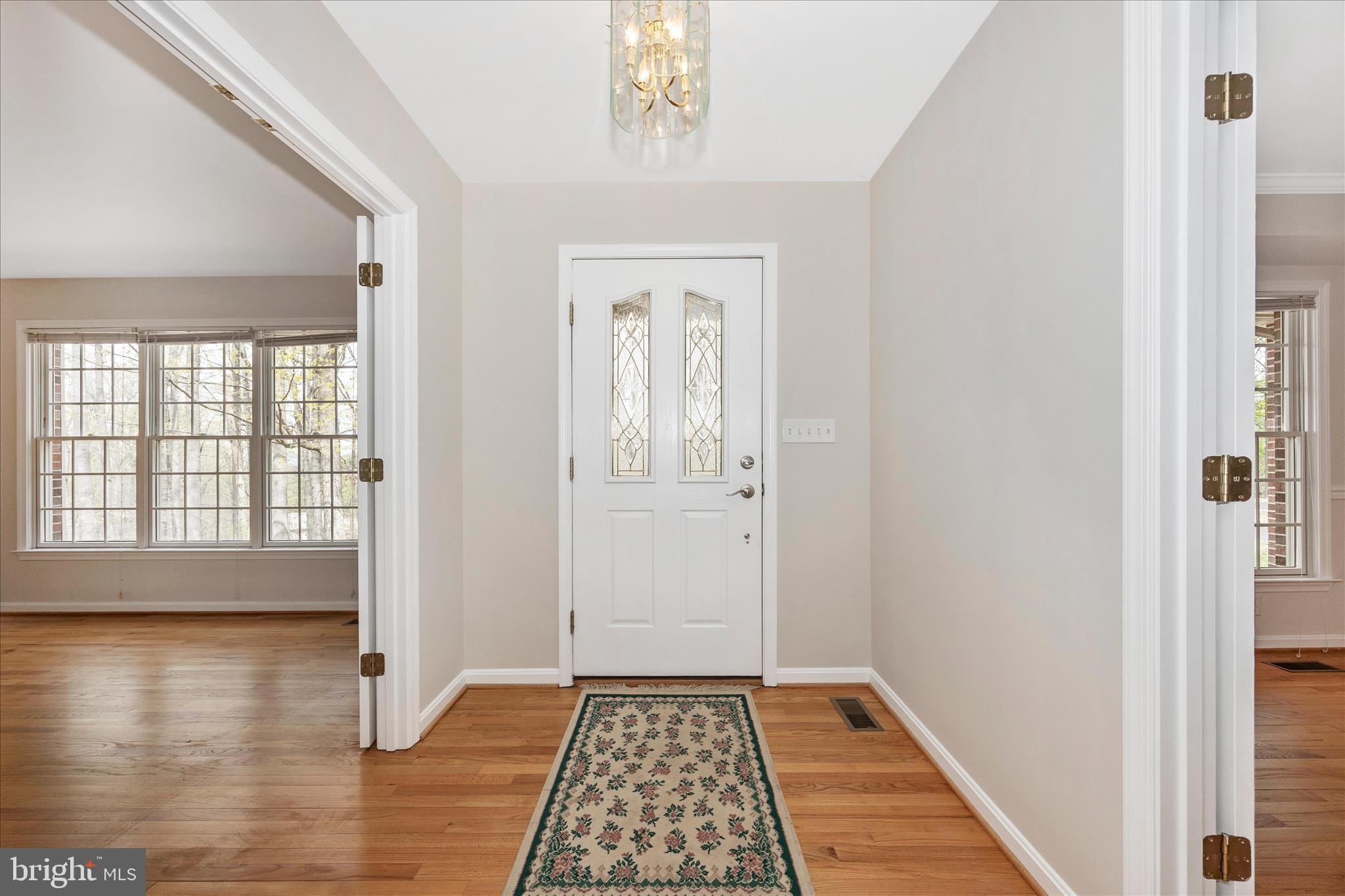 10393 Liberty Road Frederick, MD 21701 - Photo 17 of 47 a view of a hallway view with wooden floor and staircase
