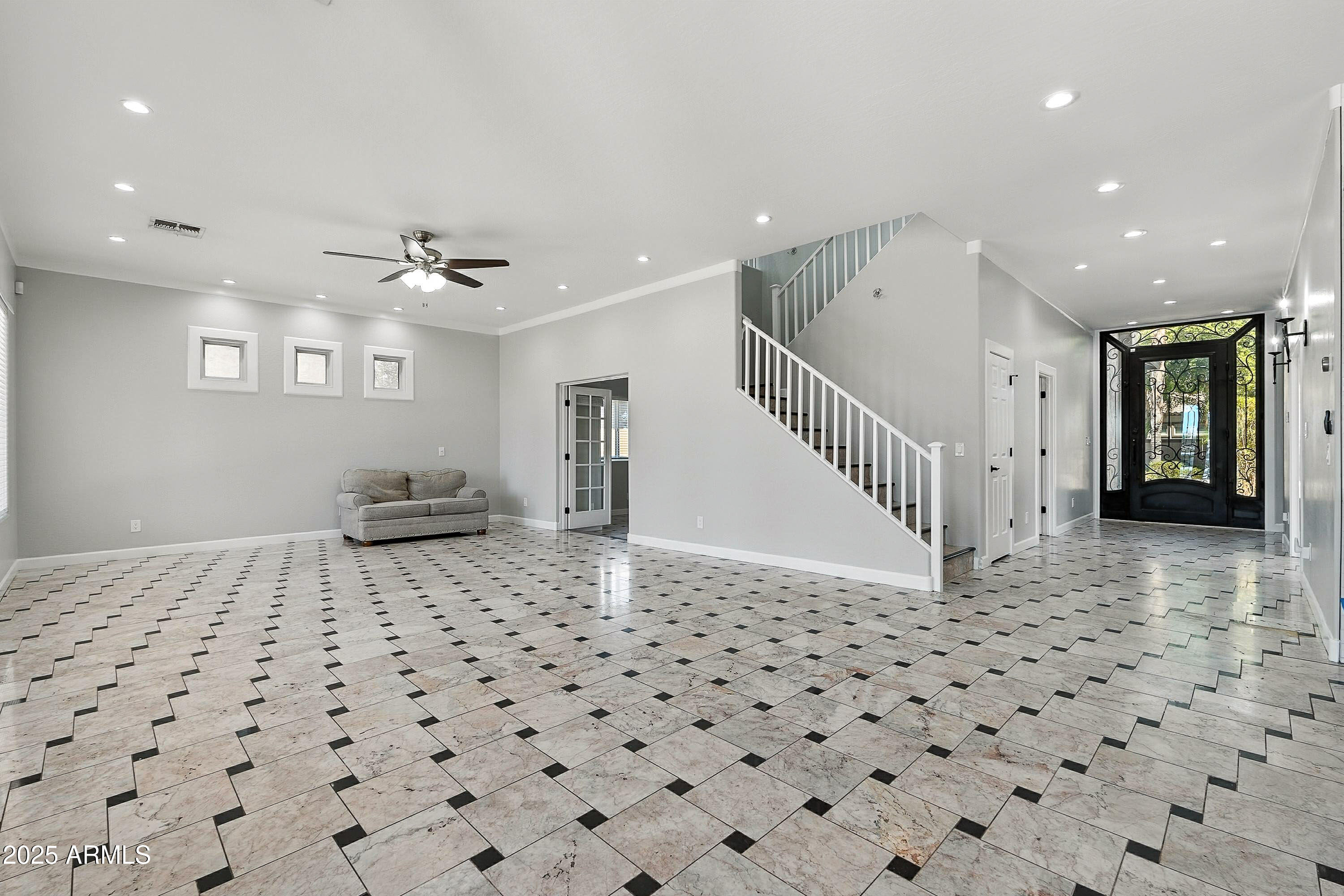 3042 South Seton Avenue Gilbert, AZ 85295 - Photo 16 of 71 a view of a hallway with a black white checkered floor
