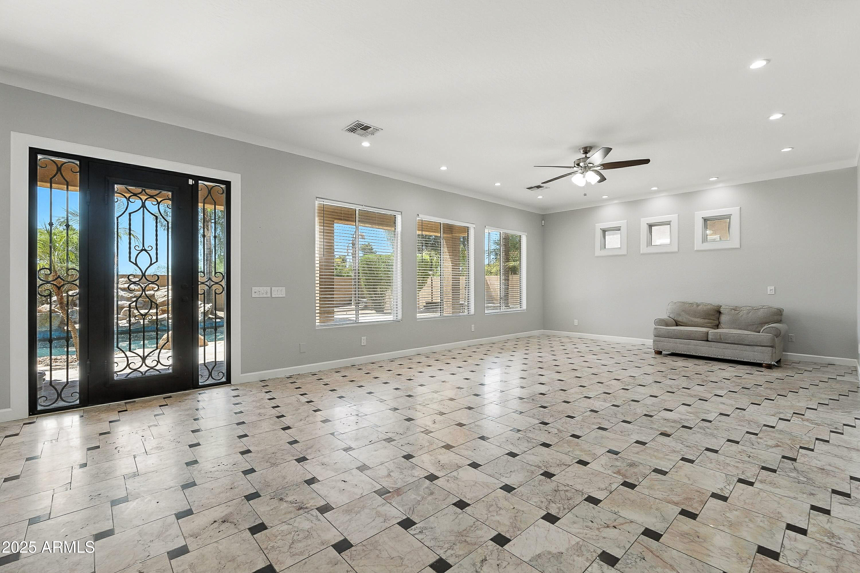 3042 South Seton Avenue Gilbert, AZ 85295 - Photo 17 of 71 a view of a livingroom with a dinning space and windows