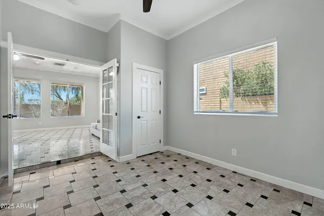 a view of an empty room with a window