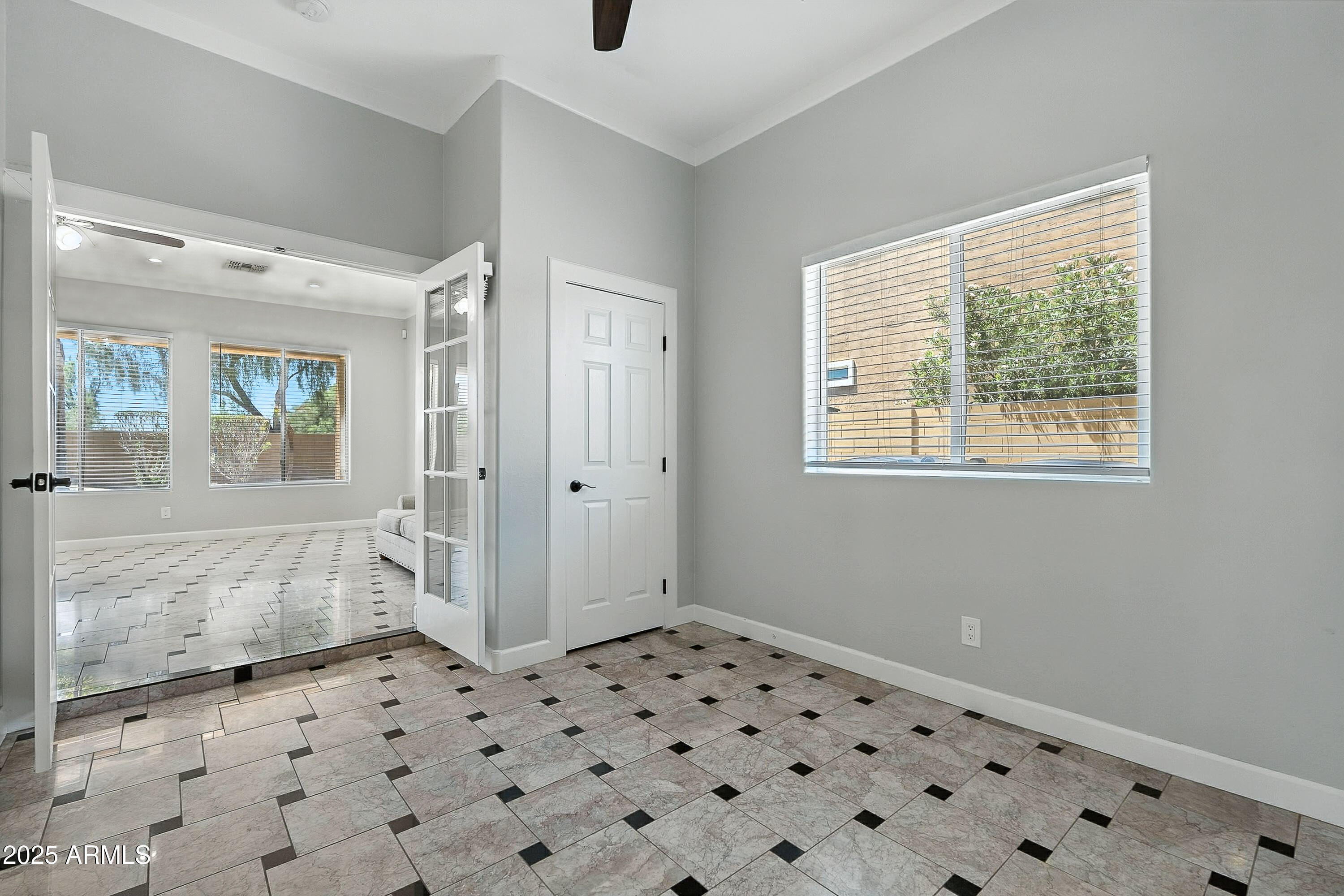 3042 South Seton Avenue Gilbert, AZ 85295 - Photo 18 of 71 a bedroom with a bed and a window