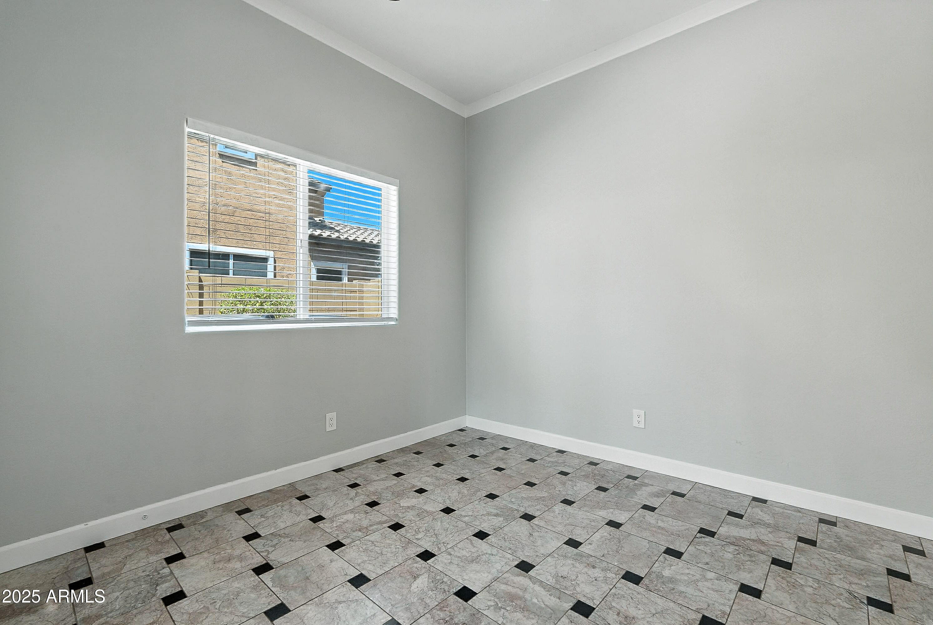 3042 South Seton Avenue Gilbert, AZ 85295 - Photo 19 of 71 a view of an empty room with a window