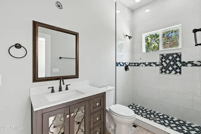 a bedroom with windows