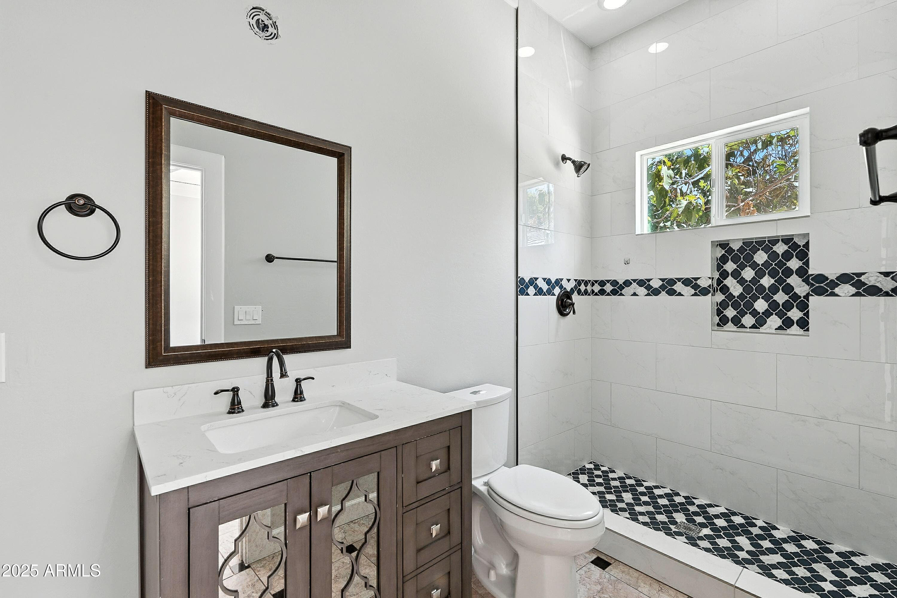 3042 South Seton Avenue Gilbert, AZ 85295 - Photo 24 of 71 a bathroom with a sink a toilet and shower