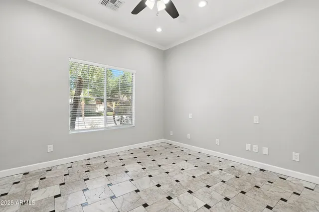a view of a hallway with wooden floor and windows