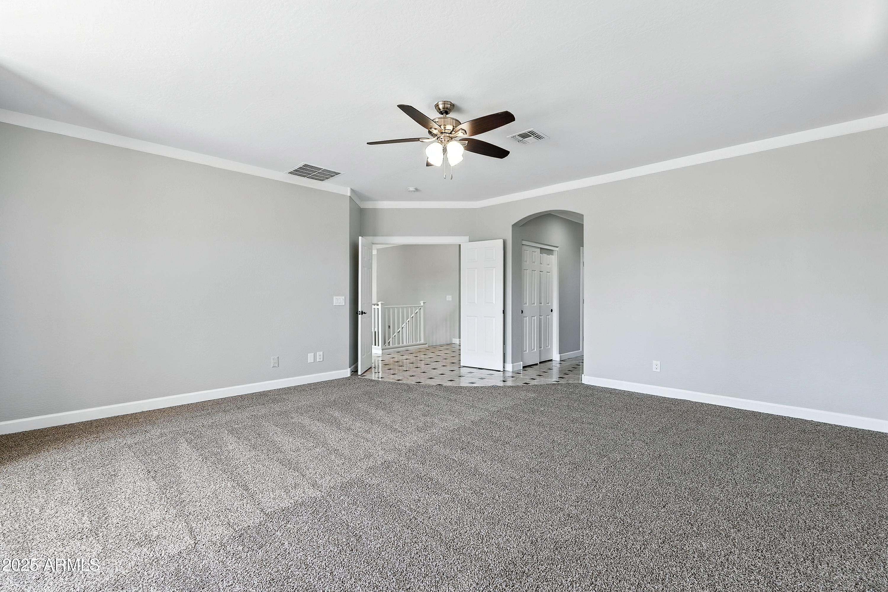 3042 South Seton Avenue Gilbert, AZ 85295 - Photo 33 of 71 a view of an empty room with a ceiling fan