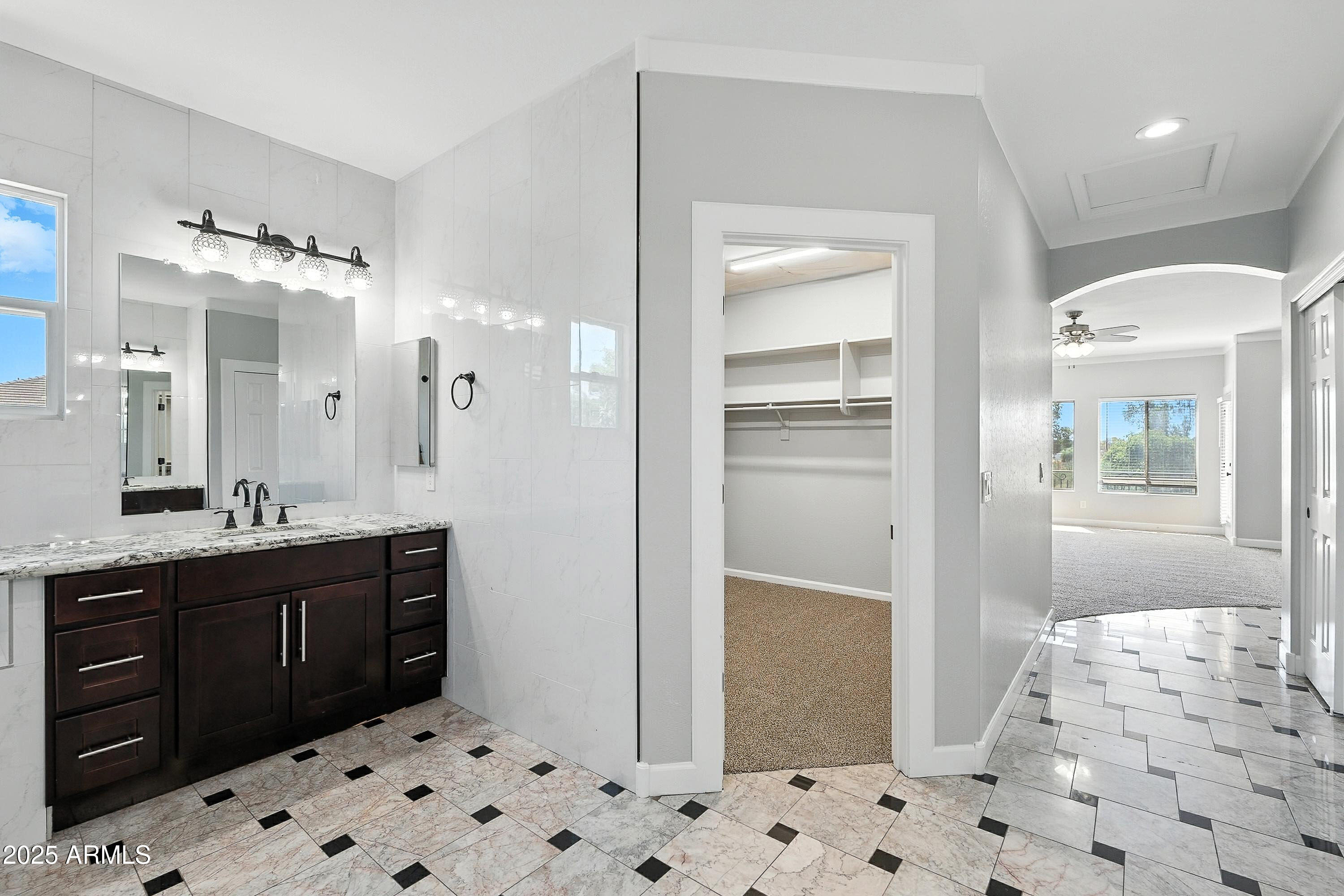 3042 South Seton Avenue Gilbert, AZ 85295 - Photo 38 of 71 a bathroom with a sink a toilet a shower and a mirror