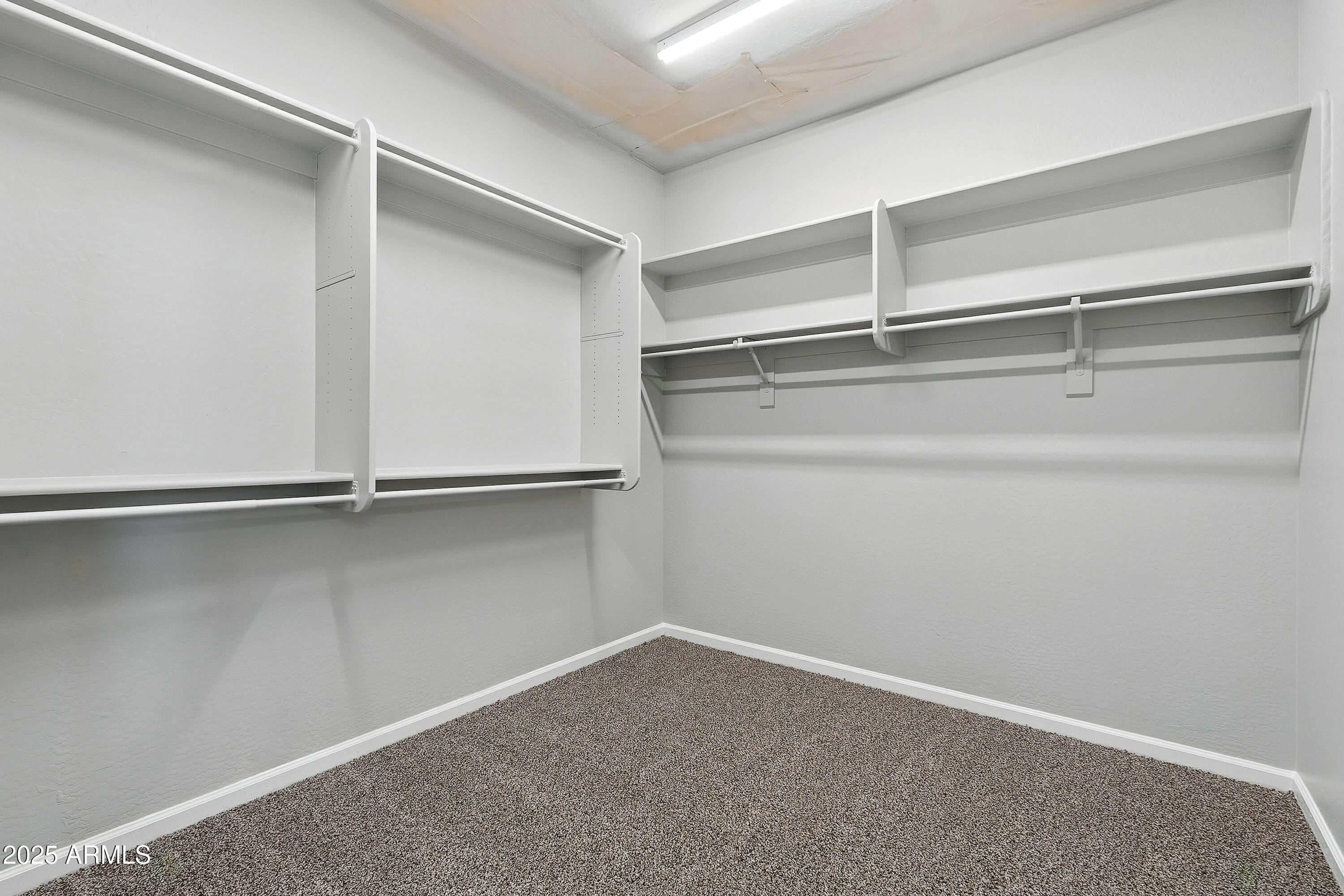 3042 South Seton Avenue Gilbert, AZ 85295 - Photo 40 of 71 a view of an empty walk in closet