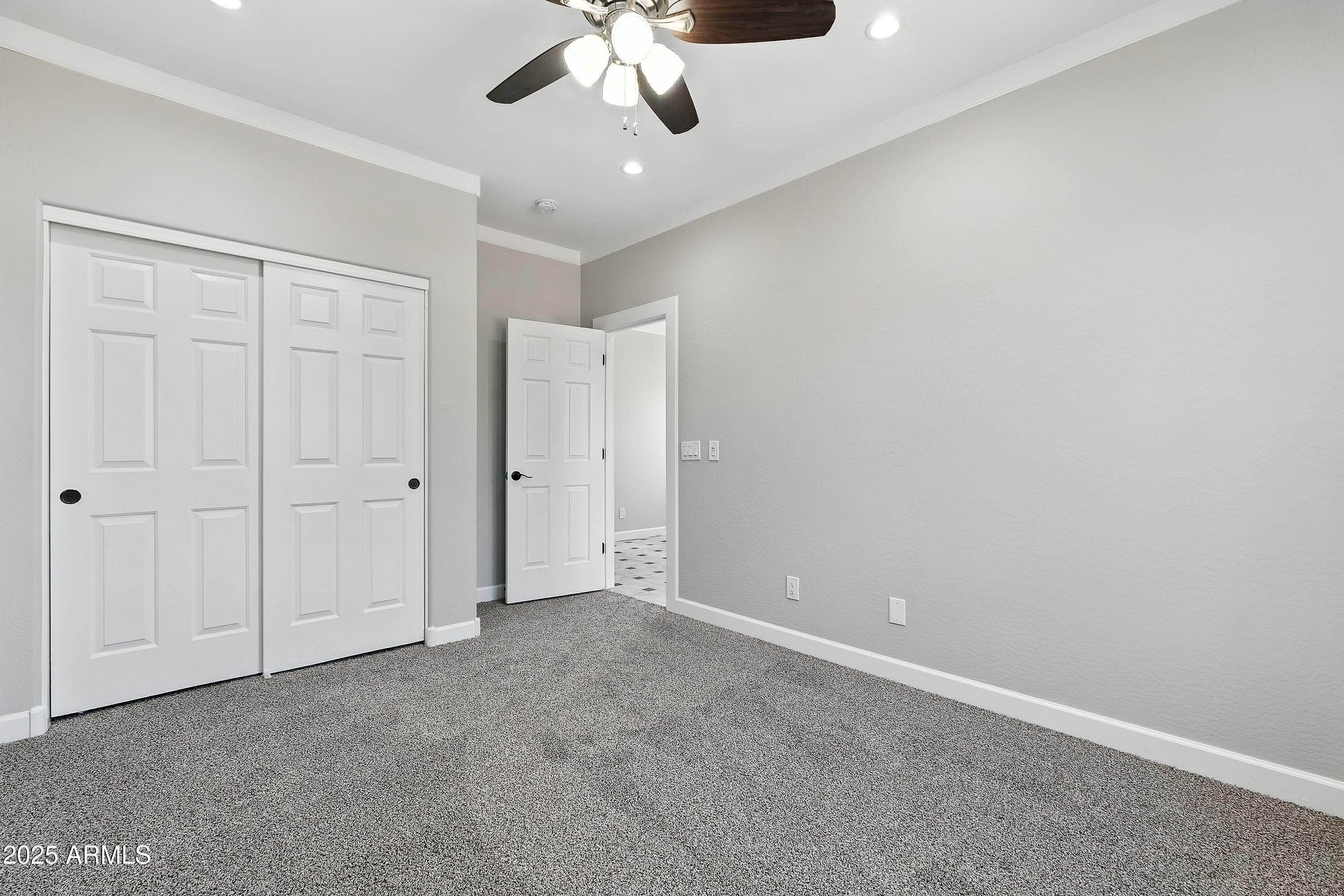 3042 South Seton Avenue Gilbert, AZ 85295 - Photo 47 of 71 a view of an empty room and chandelier fan