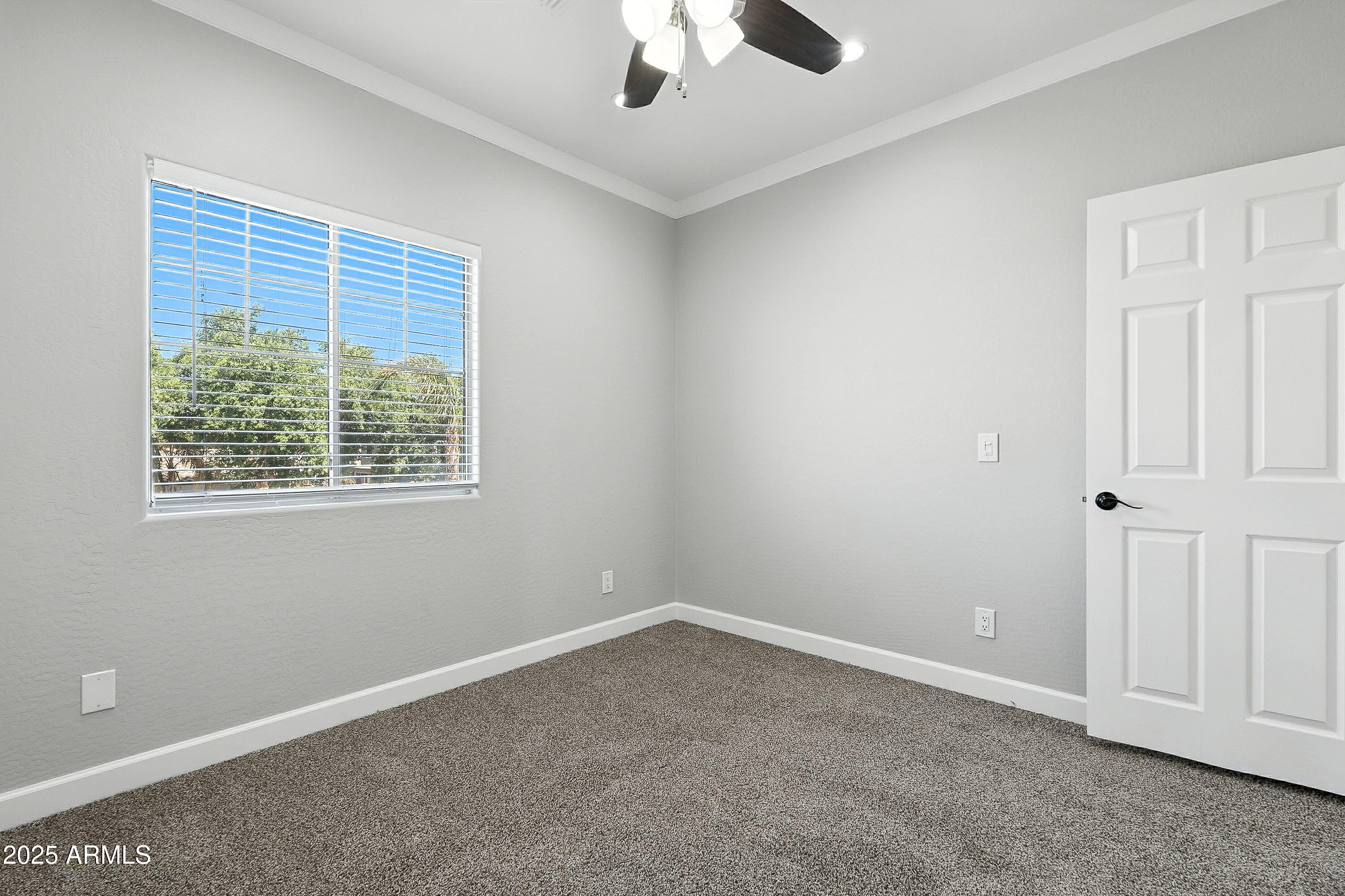 3042 South Seton Avenue Gilbert, AZ 85295 - Photo 49 of 71 an empty room with a window