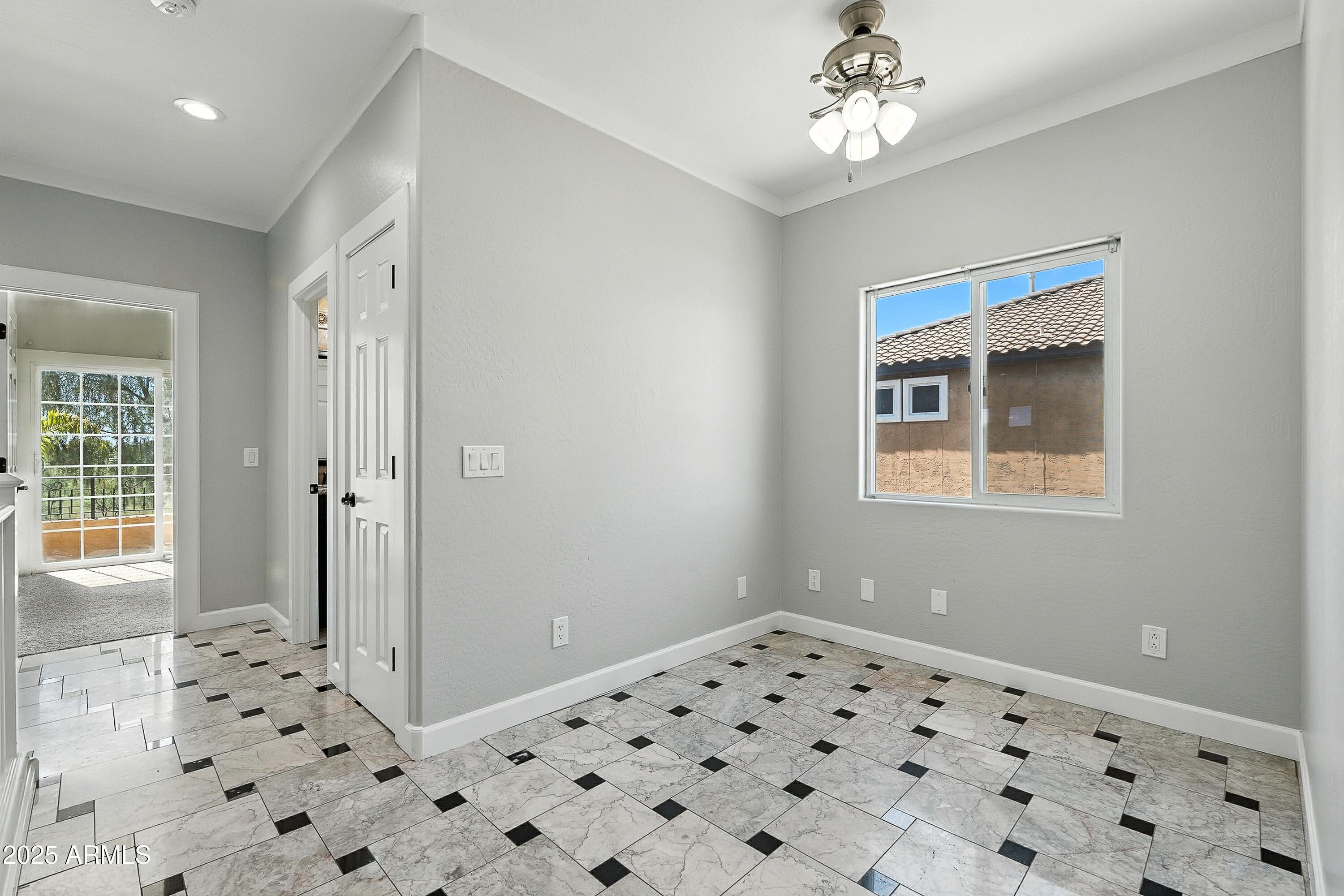 3042 South Seton Avenue Gilbert, AZ 85295 - Photo 50 of 71 a view of a hallway to a bedroom with a window
