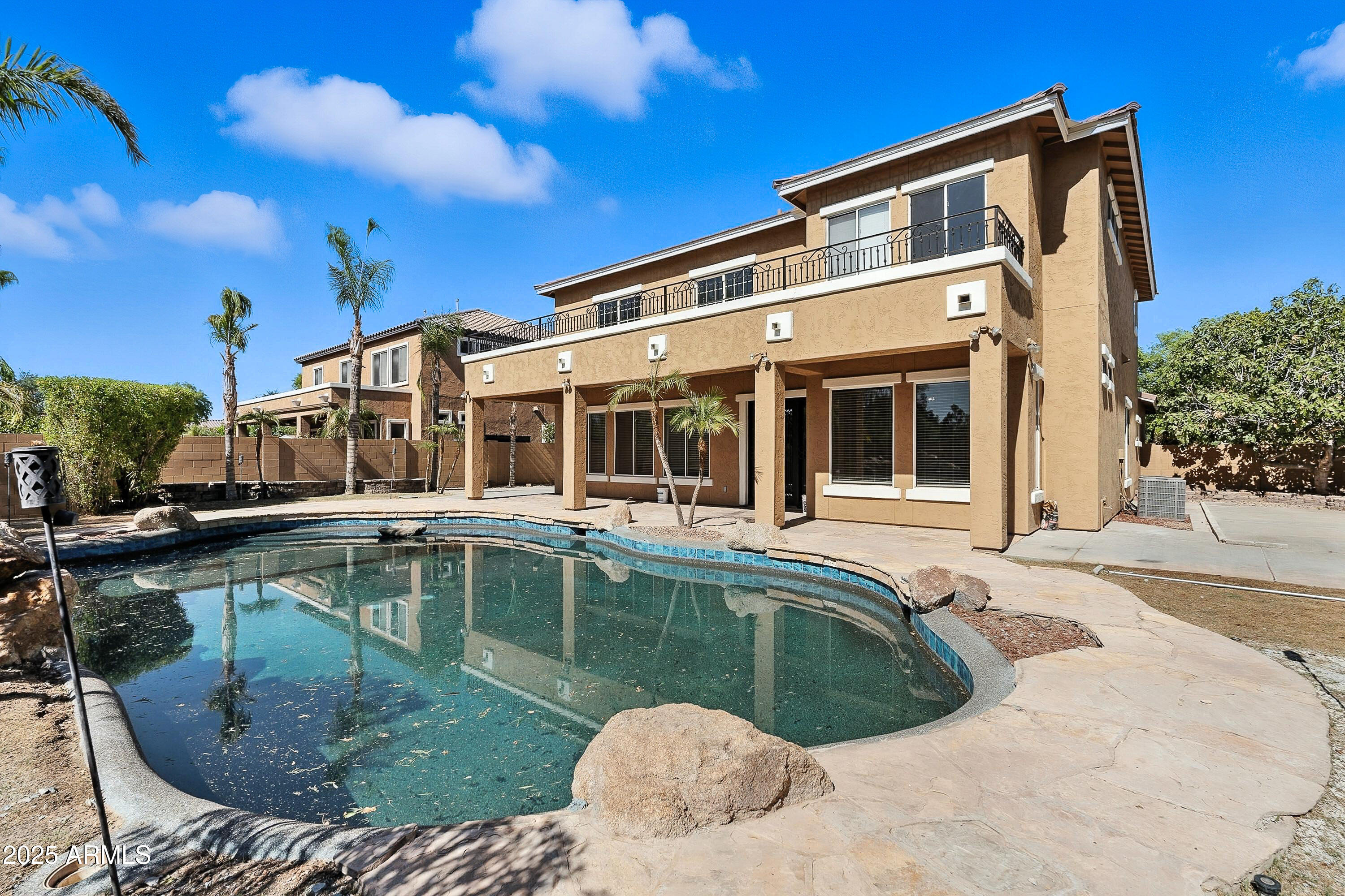 3042 South Seton Avenue Gilbert, AZ 85295 - Photo 59 of 71 a house with swimming pool in front of it
