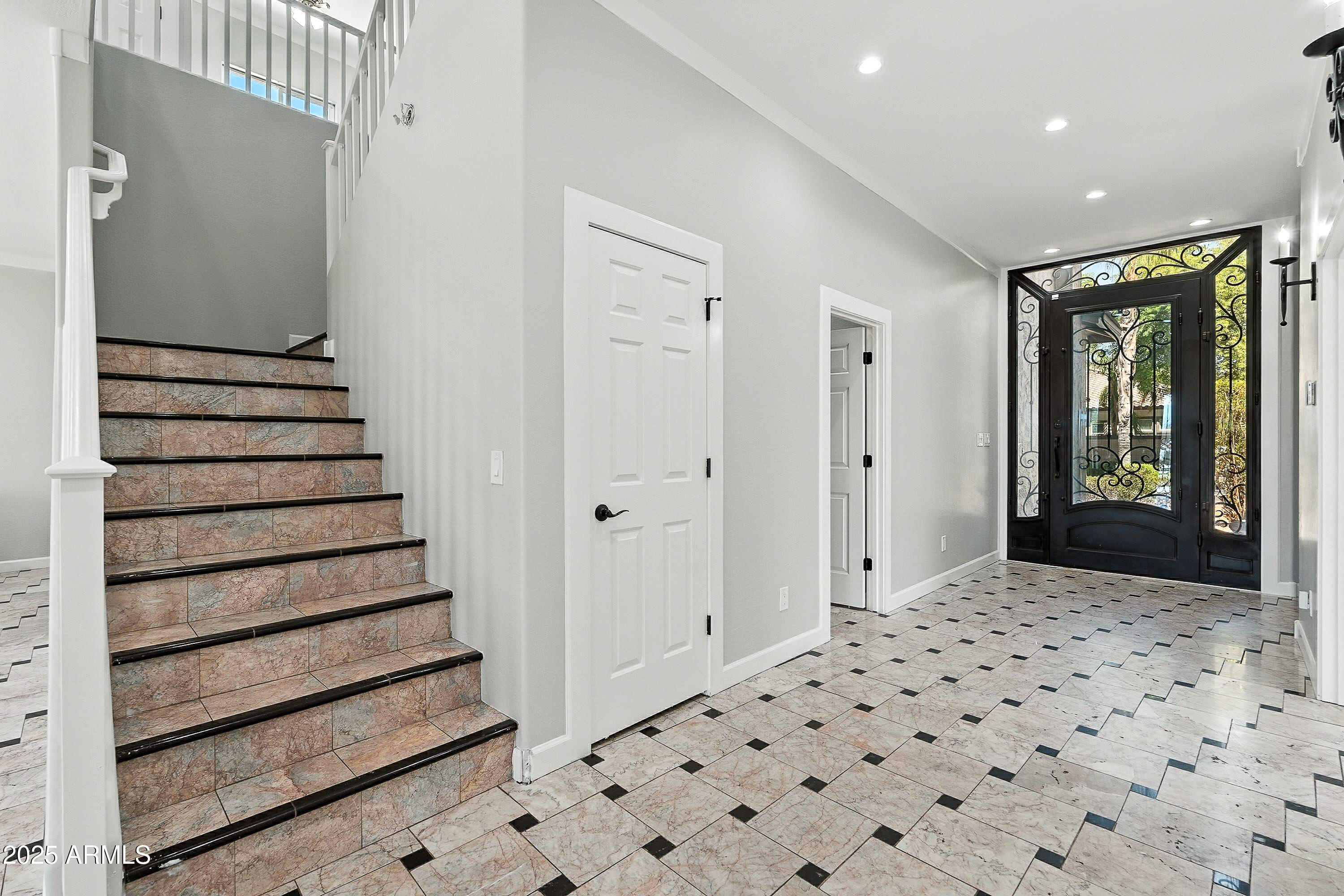 3042 South Seton Avenue Gilbert, AZ 85295 - Photo 5 of 71 a view of a hallway with wooden cabinets and staircase