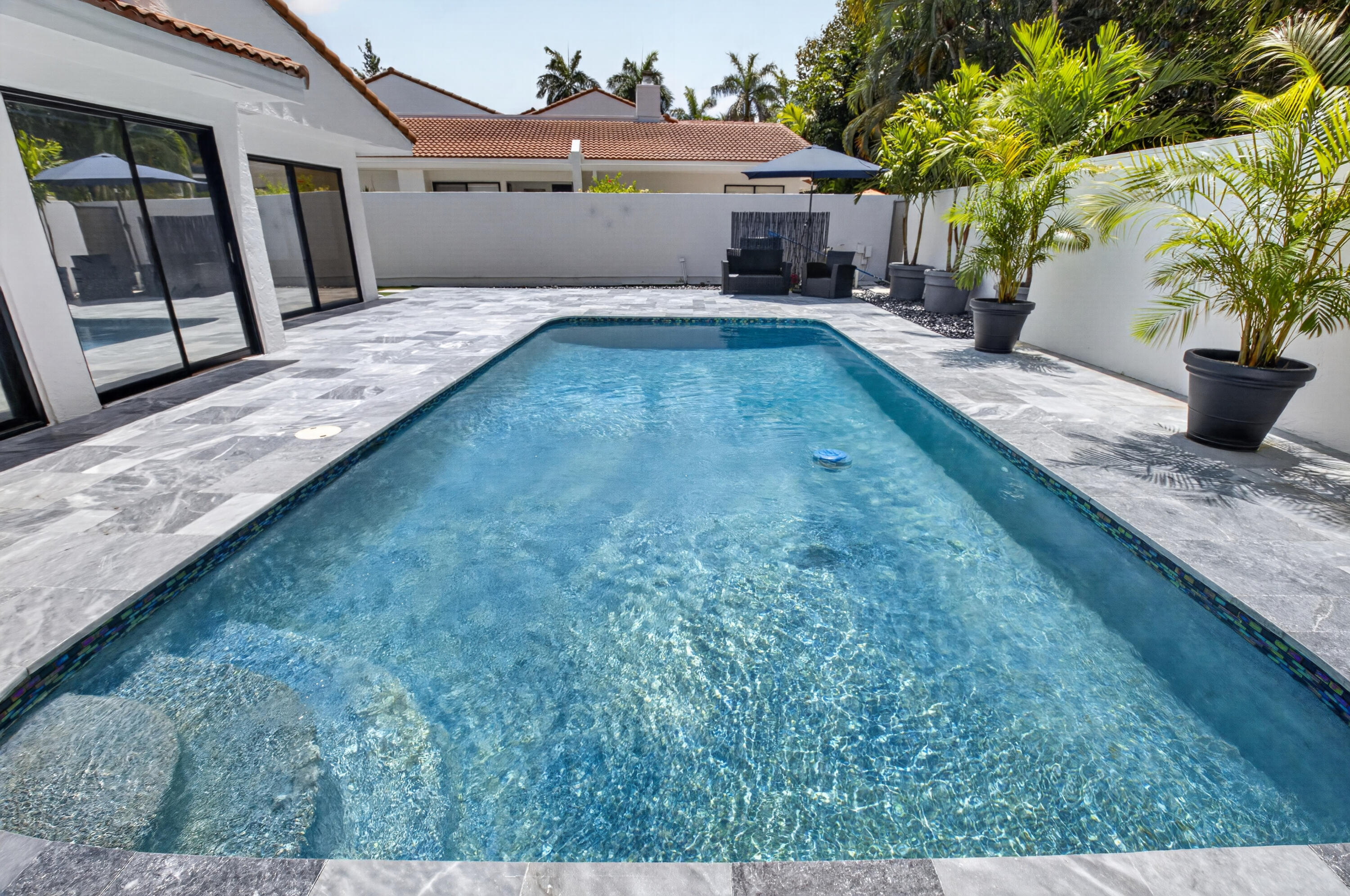 7374 Woodmont Court Boca Raton, FL 33434 - Photo 41 of 95 a front view of a house with a yard