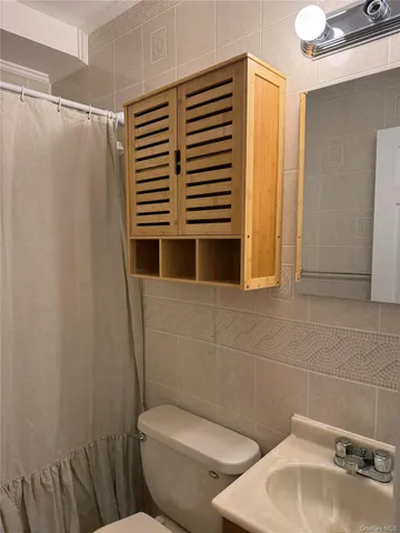 a bathroom with a toilet and sink