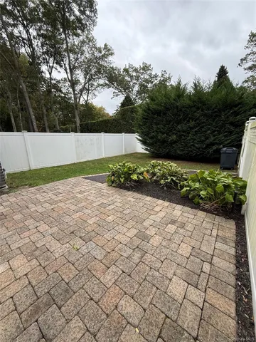 a view of backyard with large trees