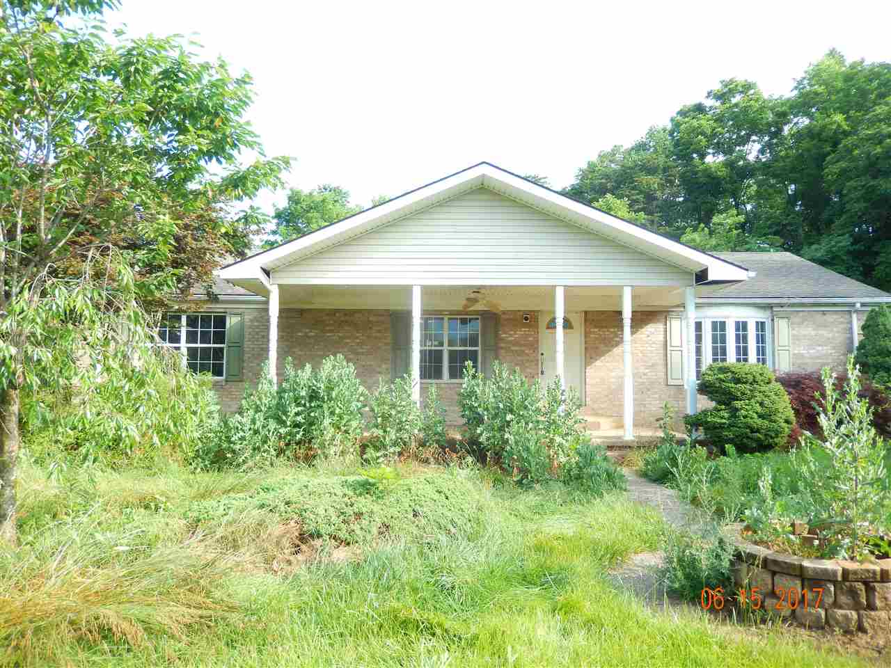 3277 Jollett Road Elkton, VA 22827 - Photo 1 of 8 a front view of a house with garden