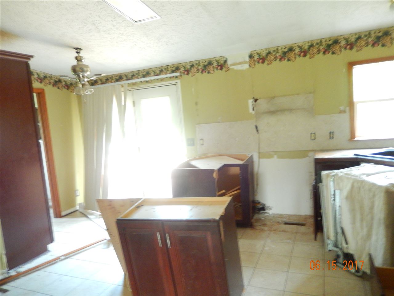 3277 Jollett Road Elkton, VA 22827 - Photo 4 of 8 a living room with a sink furniture and a large window