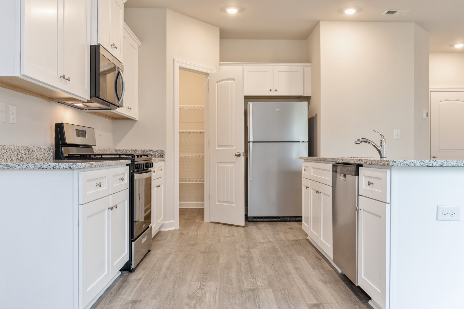 2306 Nabali Way Murfreesboro, TN 37127 - Photo 13 of 19 a kitchen with stainless steel appliances a refrigerator sink and cabinets