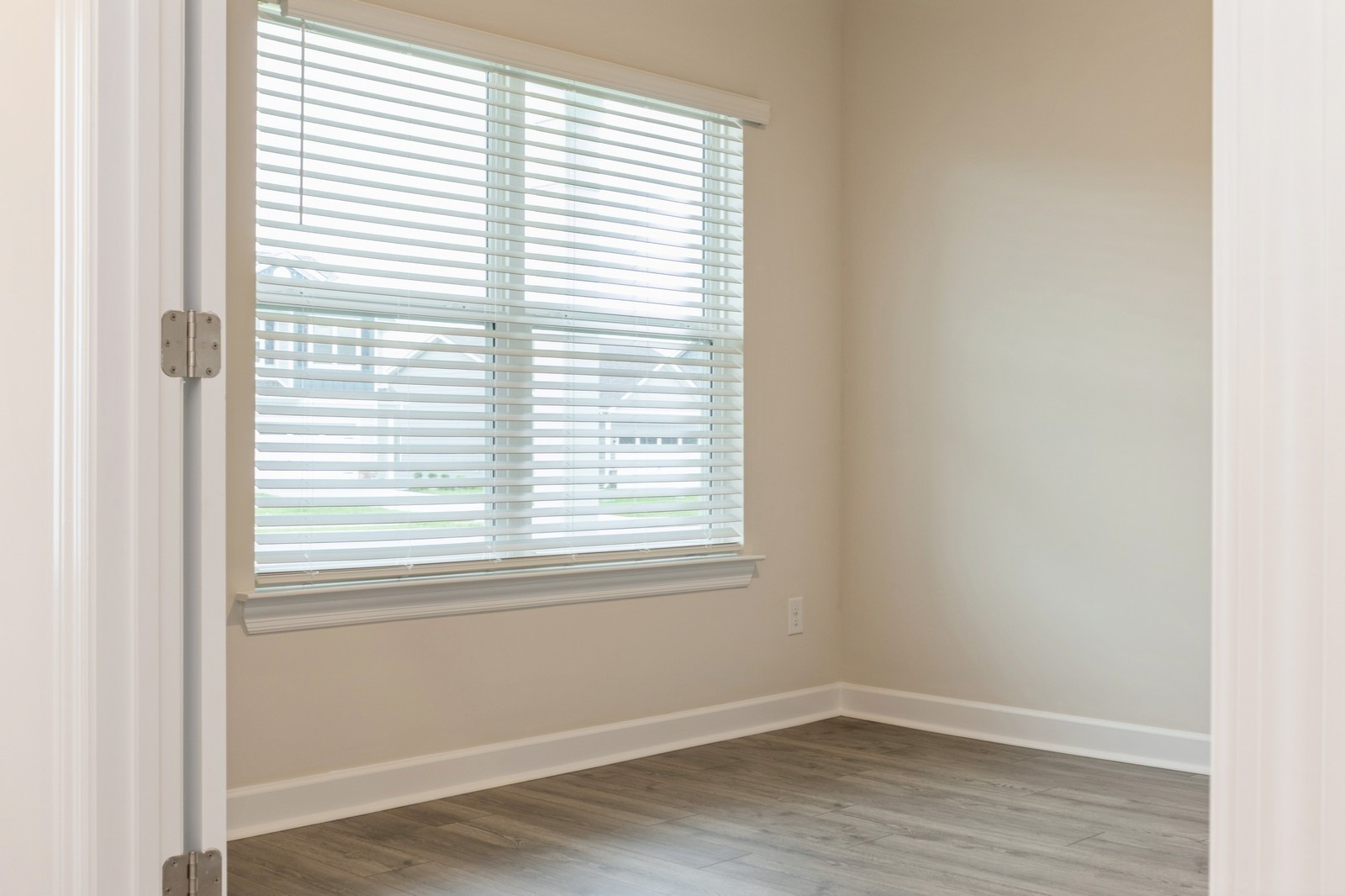 2306 Nabali Way Murfreesboro, TN 37127 - Photo 16 of 19 a view of an empty room with wooden floor and a window