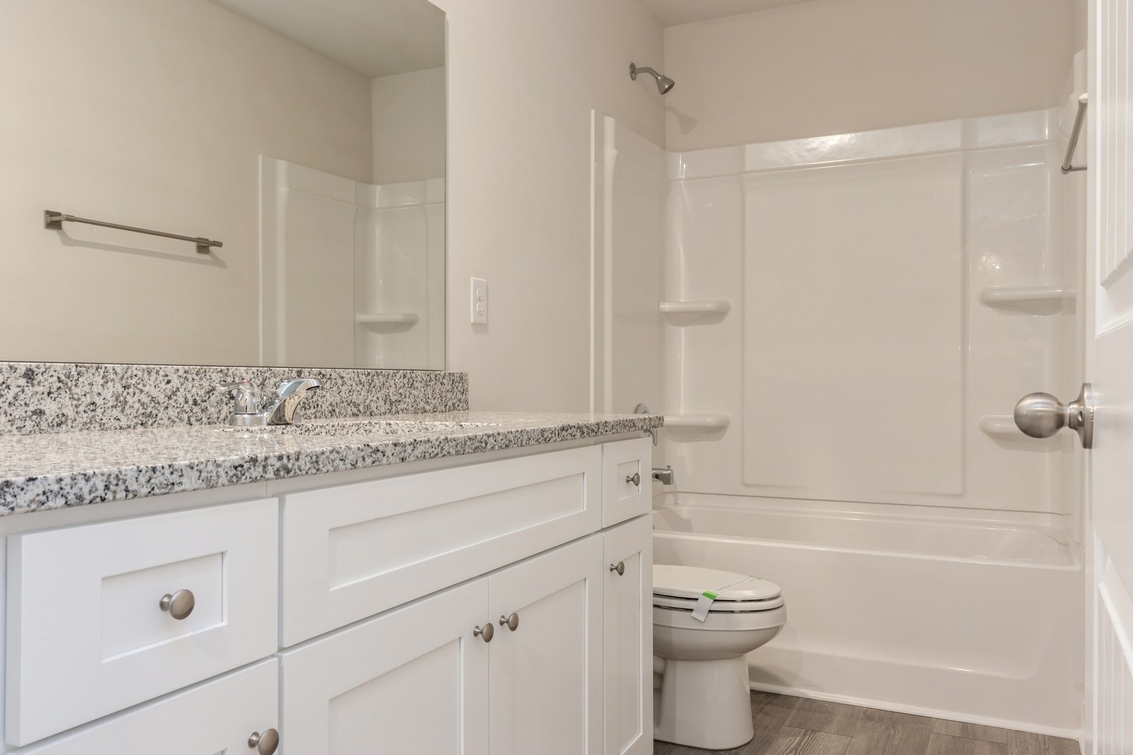 2306 Nabali Way Murfreesboro, TN 37127 - Photo 7 of 19 a bathroom with a granite countertop sink a toilet and shower