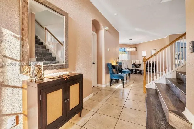 a lobby with furniture and a stove