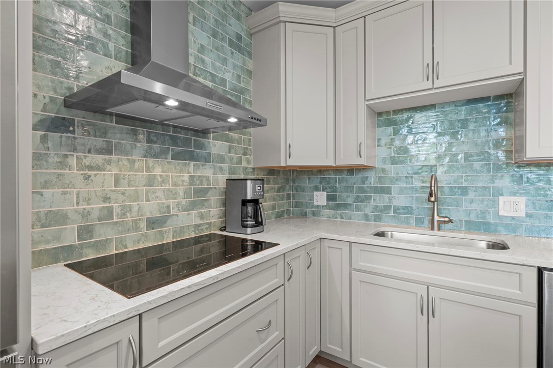 12546 Cedar Road, Unit 4 Cleveland Heights, OH 44106 - Photo 19 of 43 Newer windows, gourmet Kitchen taken down to the studs with center island and breakfast bar, 2 sinks, quartz counters, all Bosch stainless appliances with induction range and 2 ovens for large gatherings