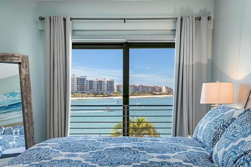 310 La Peninsula Boulevard, Unit 310 Naples, FL 34113 - Photo 15 of 27 a view of a bedroom