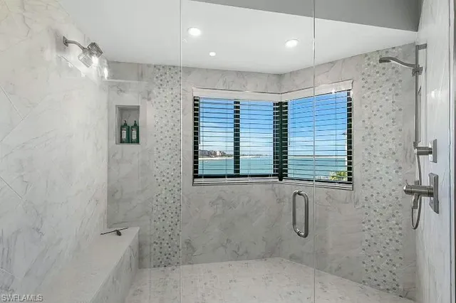 a bathroom with a shower and a shower