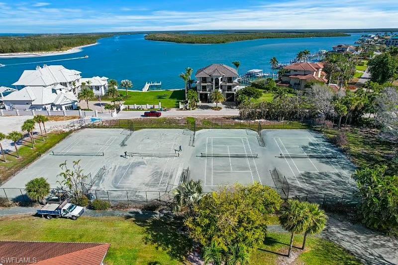 310 La Peninsula Boulevard, Unit 310 Naples, FL 34113 - Photo 25 of 27 a view of yard with outdoor seating