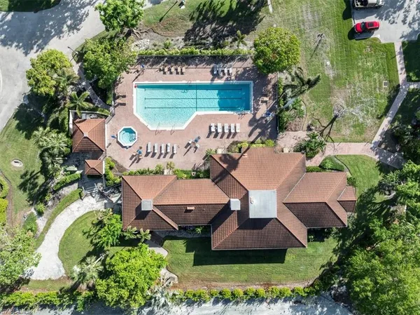 an aerial view of a house with yard swimming pool and outdoor seating