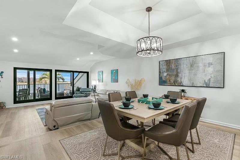 310 La Peninsula Boulevard, Unit 310 Naples, FL 34113 - Photo 9 of 27 a view of a dining room with furniture window and outside view