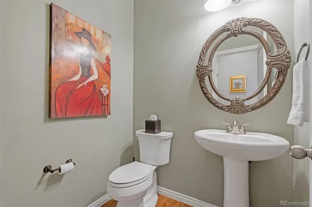 a bathroom with a toilet and a sink